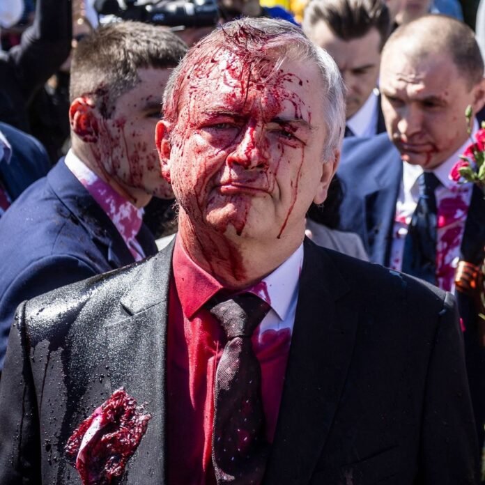 Demonstrators in Poland's capital on Monday attacked Russian Ambassador Sergei A