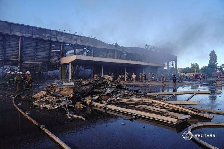 Rescuers work at a site of a shopping mall hit by a Russian missile strike in Kr